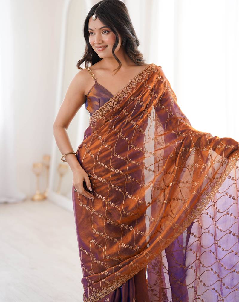 Rust tissue embridered saree with unstitched blouse piece