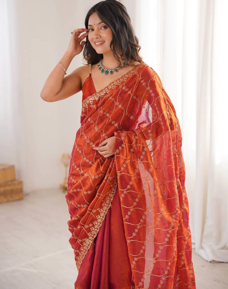 Orange tissue embridered saree with unstitched blouse piece