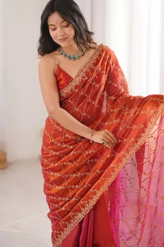 Orange tissue embridered saree with unstitched blouse piece