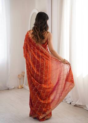Orange tissue embridered saree with unstitched blouse piece 4