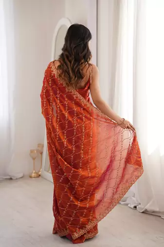 Orange tissue embridered saree with unstitched blouse piece
