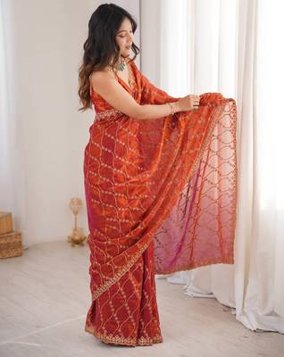 Orange tissue embridered saree with unstitched blouse piece 5