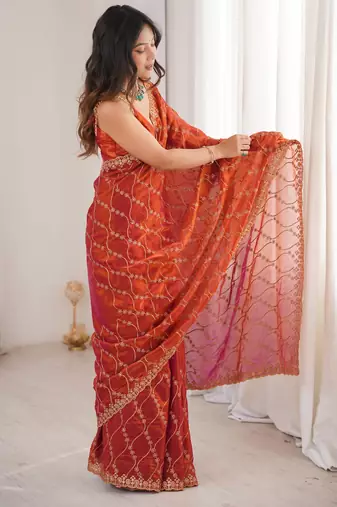 Orange tissue embridered saree with unstitched blouse piece