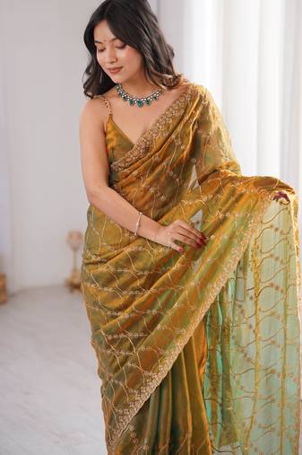 Gold tissue embridered saree with unstitched blouse piece