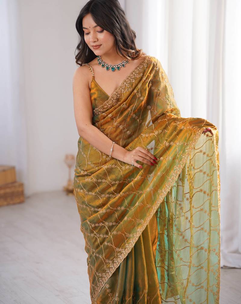 Gold tissue embridered saree with unstitched blouse piece