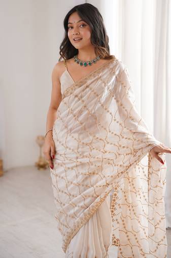 Cream tissue embridered saree with unstitched blouse piece