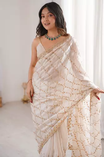Cream tissue embridered saree with unstitched blouse piece