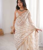 Cream tissue embridered saree with unstitched blouse piece
