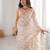Cream tissue embridered saree with unstitched blouse piece