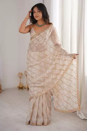 Cream tissue embridered saree with unstitched blouse piece