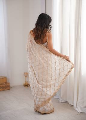 Cream tissue embridered saree with unstitched blouse piece 3
