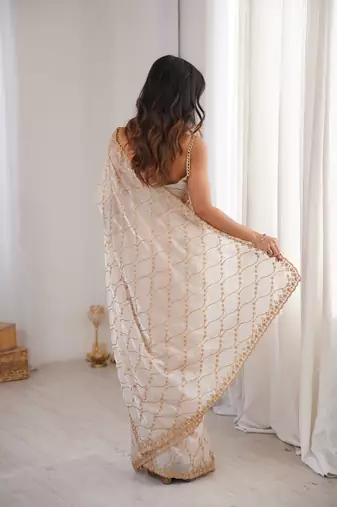 Cream tissue embridered saree with unstitched blouse piece