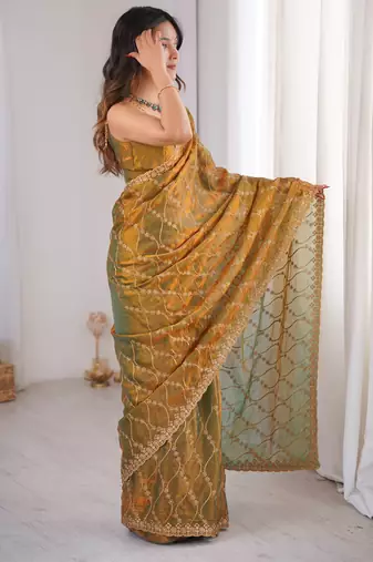 Gold tissue embridered saree with unstitched blouse piece