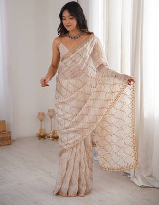 Cream tissue embridered saree with unstitched blouse piece 4
