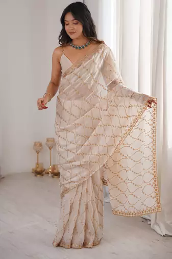 Cream tissue embridered saree with unstitched blouse piece