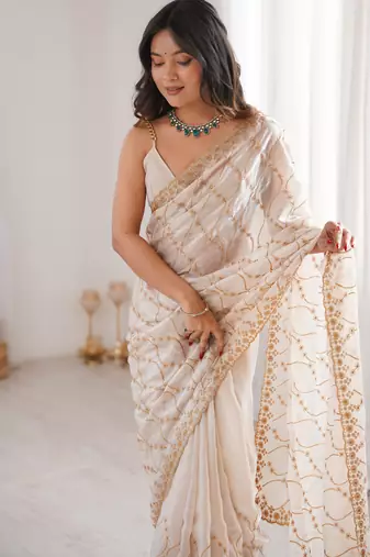 Cream tissue embridered saree with unstitched blouse piece