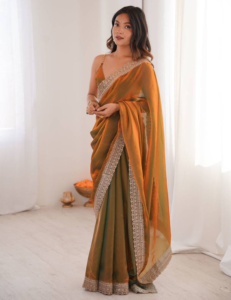 Gold tissue embridered saree with unstitched blouse piece