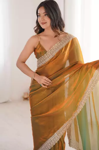 Gold tissue embridered saree with unstitched blouse piece