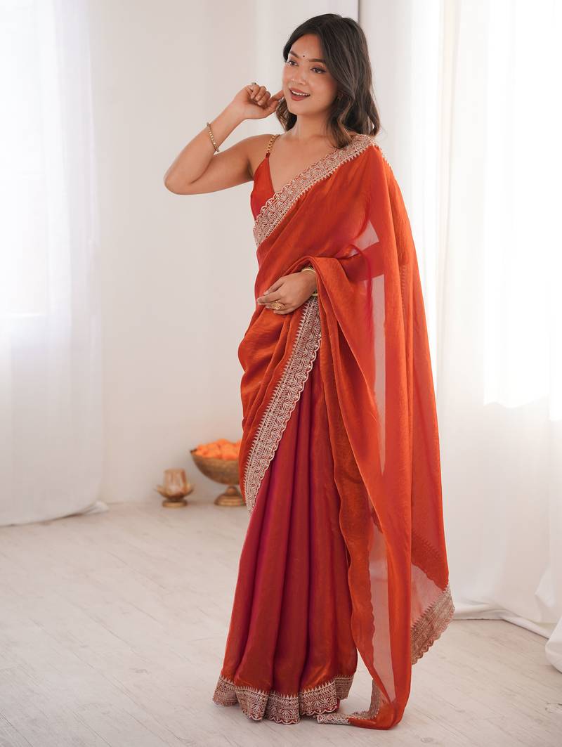 Orange tissue embridered saree with unstitched blouse piece