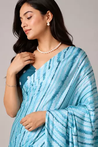 Firozi color all over traditional modern leheriya prints work japan satin saree with unstitched blouse