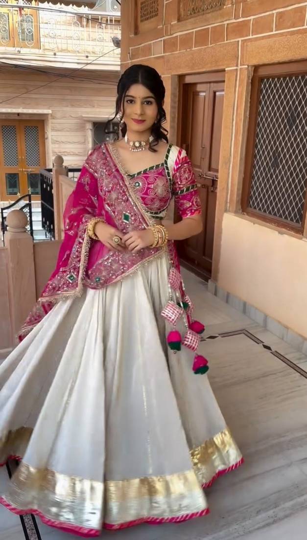 Off White & Rani Pink Heavy Thread Embroidery Sequins Work Roman Silk Navratri Lehenga Choli with Dupatta