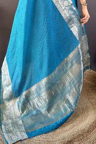 Teal nylon viscose zari woven saree with unstitched blouse piece