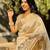 Cream tussar silk embroidered zari woven saree with unstitched blouse piece