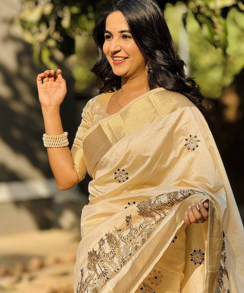 Cream tussar silk embroidered zari woven saree with unstitched blouse piece