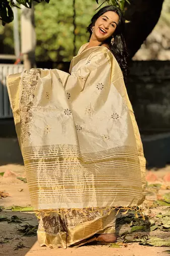 Cream tussar silk blend embroidered zari woven saree with unstitched blouse piece