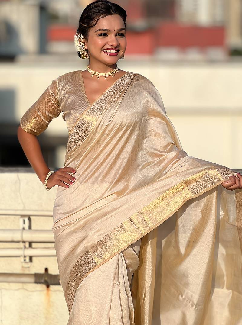 Cream tussar silk zari woven saree with unstitched blouse piece