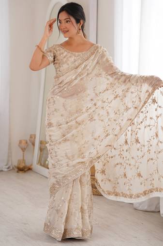 Cream tissue embridered saree with unstitched blouse piece