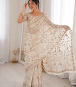 Cream tissue embridered saree with unstitched blouse piece