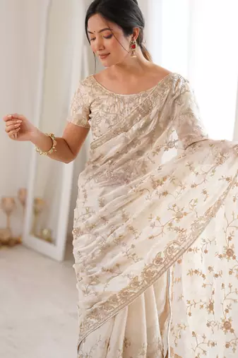 Cream tissue embridered saree with unstitched blouse piece