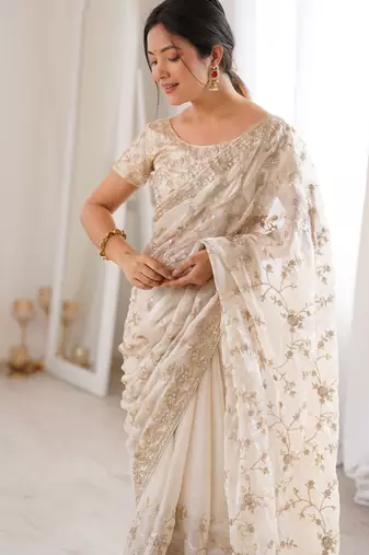 Cream tissue embridered saree with unstitched blouse piece