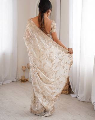 Cream tissue embridered saree with unstitched blouse piece 5