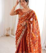 Orange tissue embridered saree with unstitched blouse piece