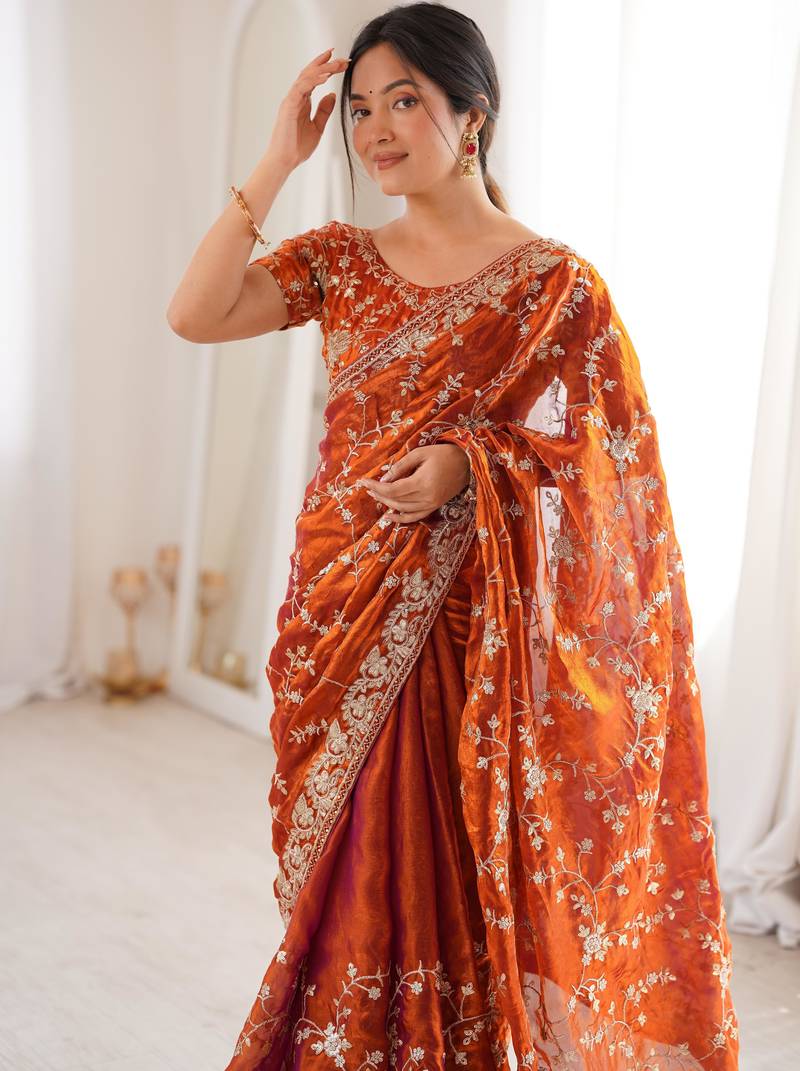 Orange tissue embridered saree with unstitched blouse piece