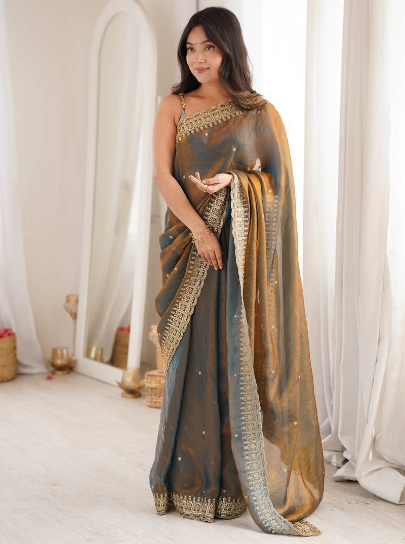Gold tissue embridered saree with unstitched blouse piece