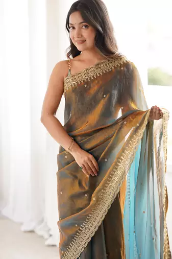 Gold tissue embridered saree with unstitched blouse piece