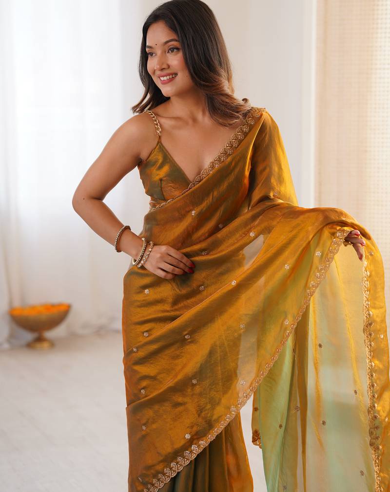 gold tissue embridered saree with unstitched blouse piece