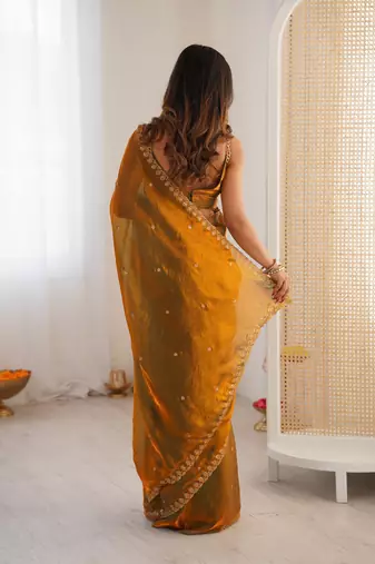 gold tissue embridered saree with unstitched blouse piece