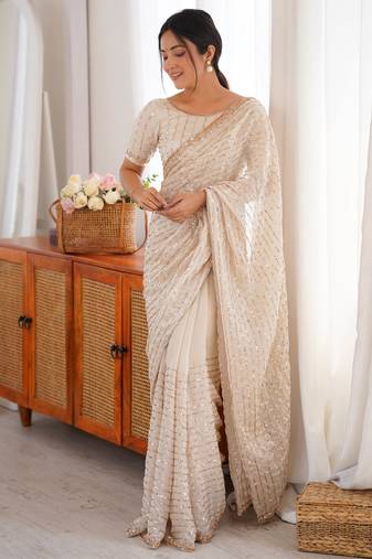cream tissue embridered saree with unstitched blouse piece