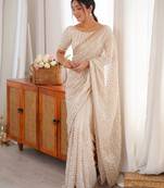 cream tissue embridered saree with unstitched blouse piece