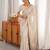 cream tissue embridered saree with unstitched blouse piece