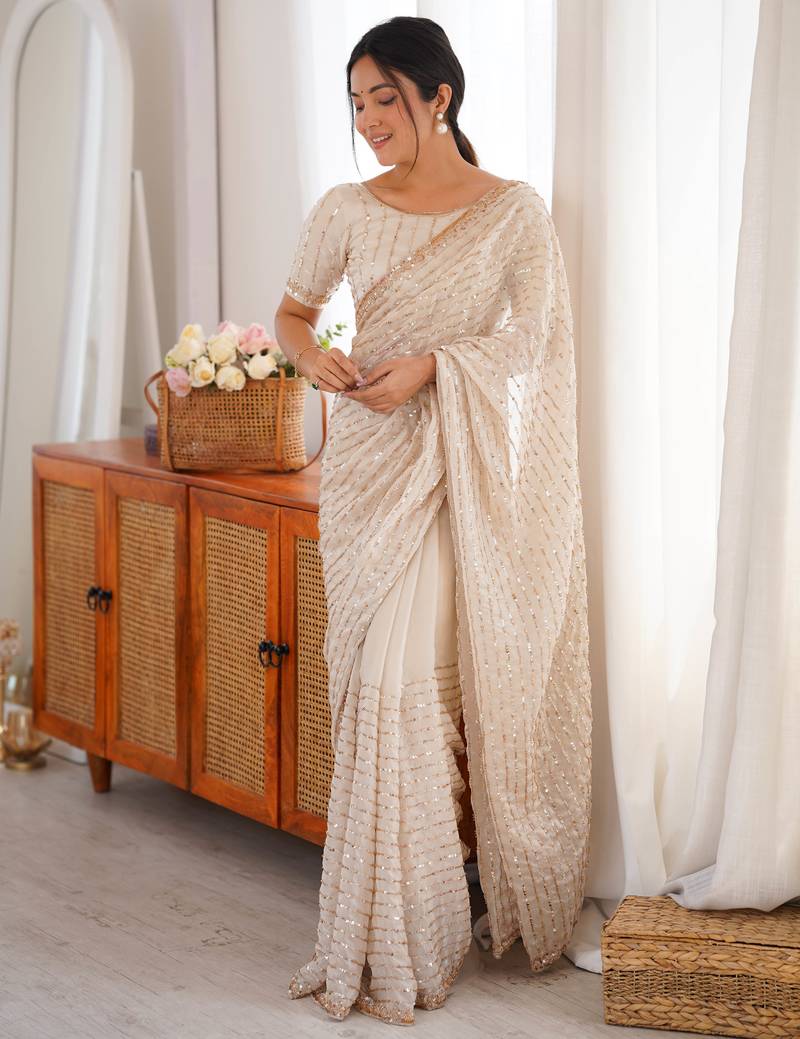 cream tissue embridered saree with unstitched blouse piece