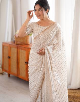 cream tissue embridered saree with unstitched blouse piece 2