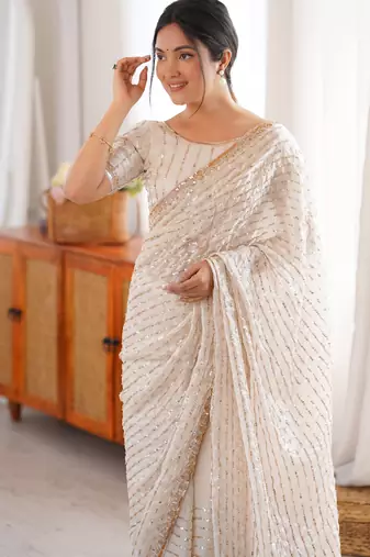 cream tissue embridered saree with unstitched blouse piece