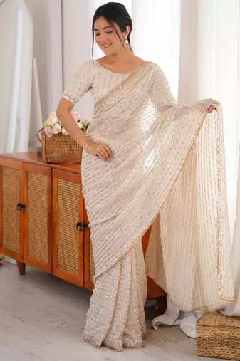 cream tissue embridered saree with unstitched blouse piece