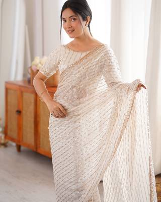 cream tissue embridered saree with unstitched blouse piece 4