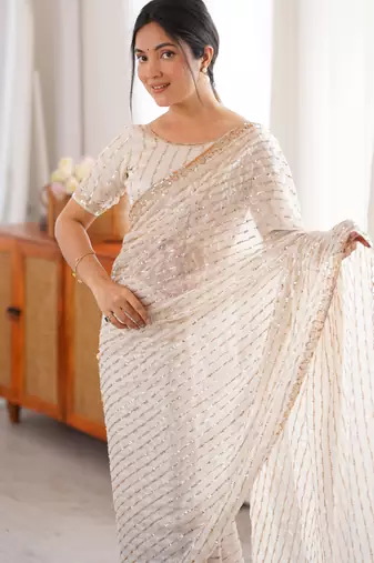 cream tissue embridered saree with unstitched blouse piece